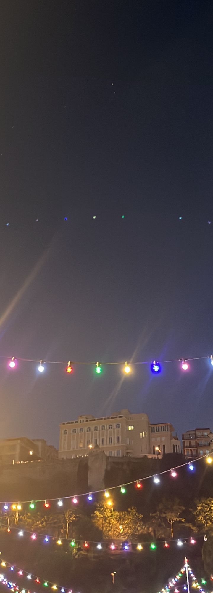festa lights, all colors — strings of festival lights above the rooftops by Din Tanovic, Stockholm photo blog