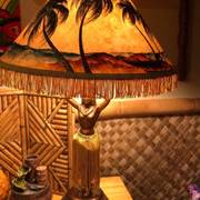 tiki lamp — warm glow, bamboo walls