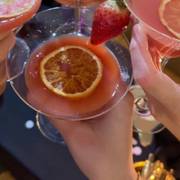 birthday — pink glass, dried citrus, another year lit up.