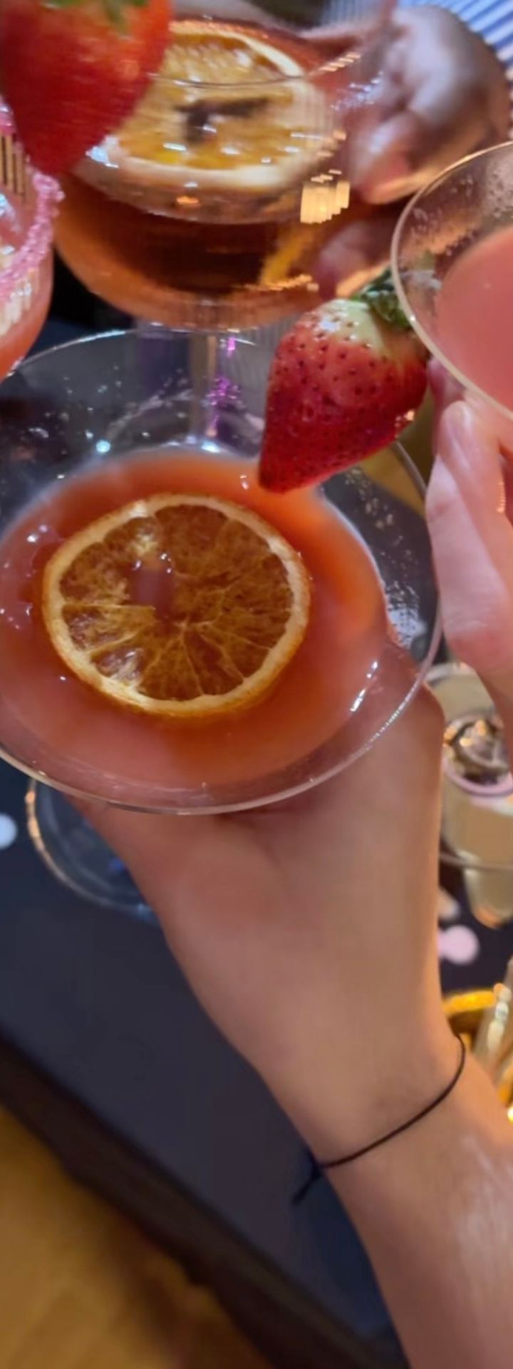 birthday — pink glass, dried citrus, another year lit up. by Din Tanovic, Stockholm photo blog