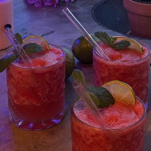 watermelon coolers — mint, lime, fairy lights on the patio — photo by Din Tanovic, Stockholm