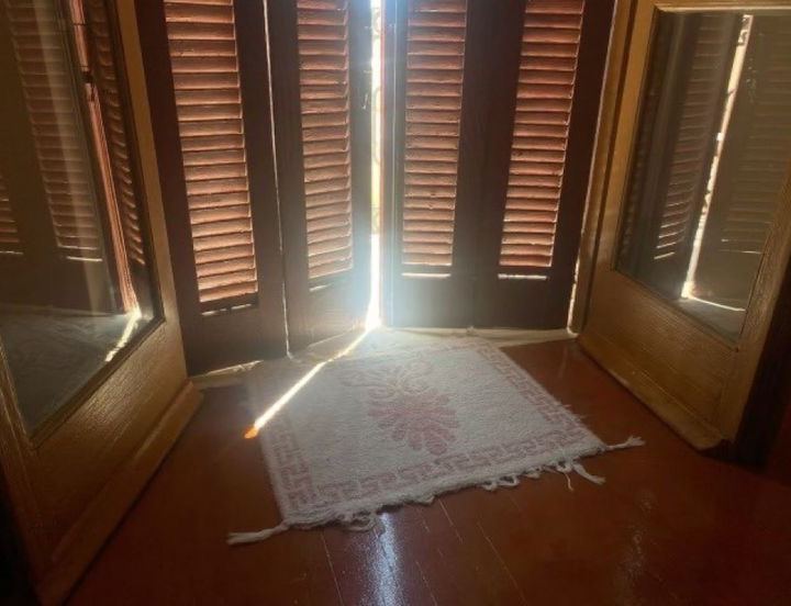 sun through shutters — old house, pink rug, quiet morning by Din Tanovic, Stockholm photo blog