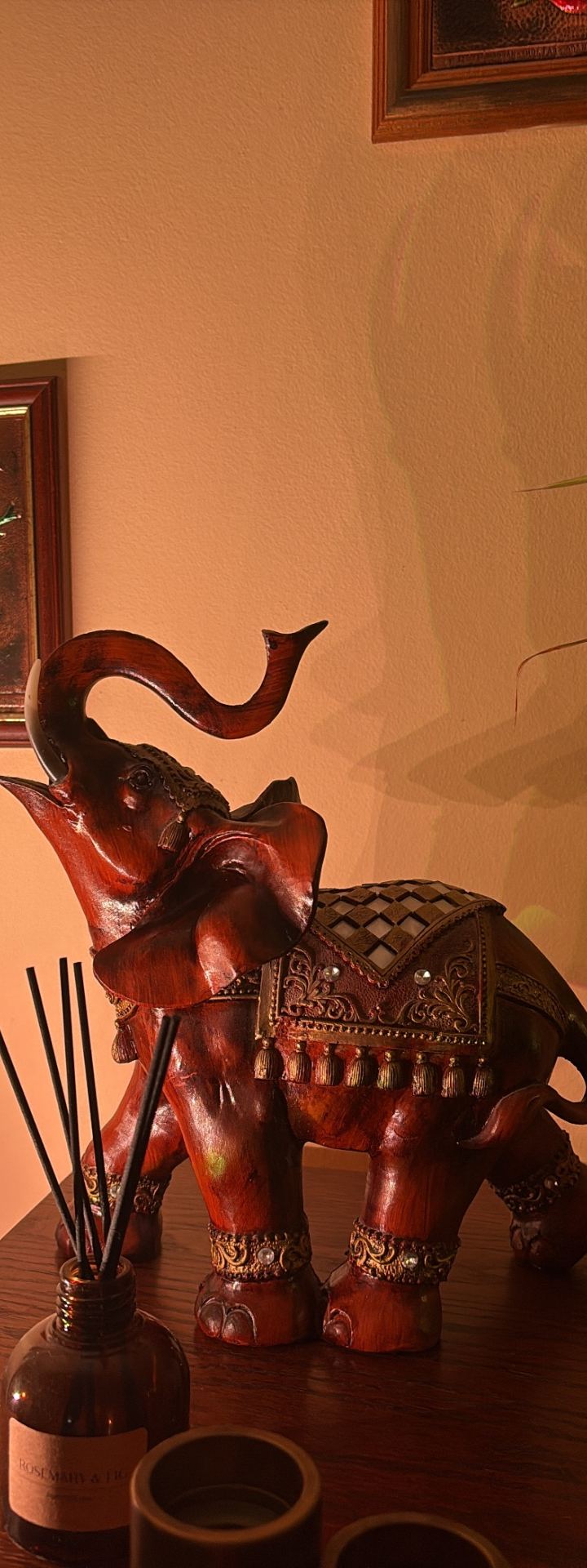 lucky elephant — incense corner, warm lamp glow by Din Tanovic, Stockholm photo blog