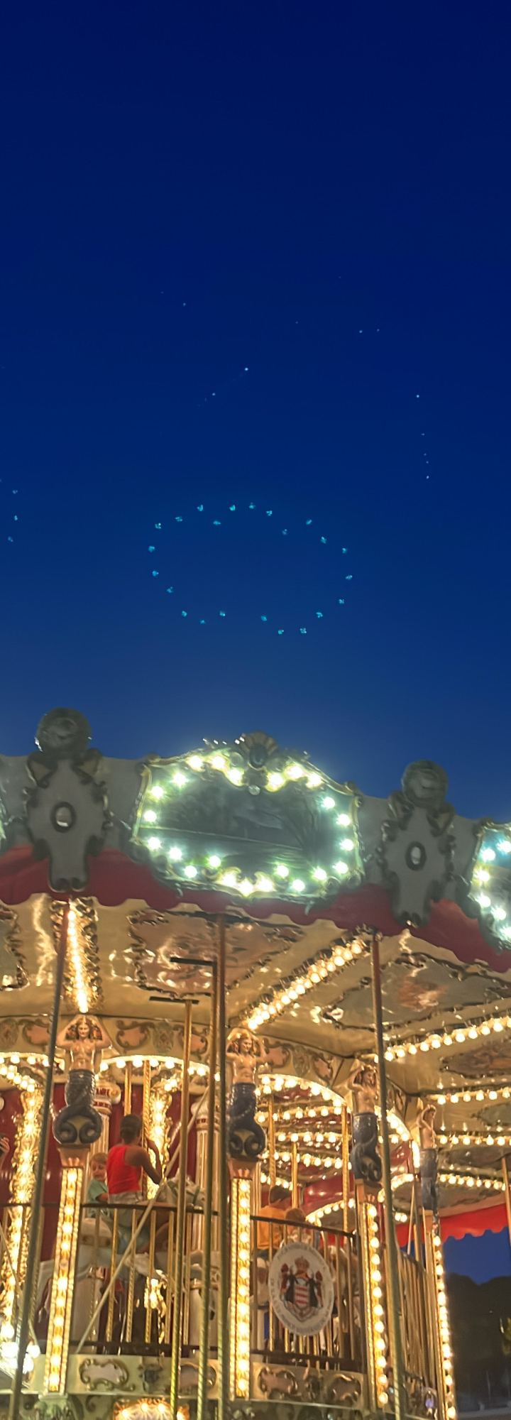 carousel & drone stars — vintage carousel under a drone-lit sky by Din Tanovic, Stockholm photo blog