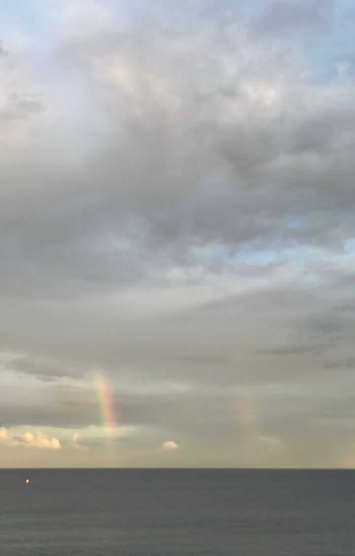 a quiet rainbow at dusk — faint double rainbow, pastel clouds by Din Tanovic, Stockholm photo blog