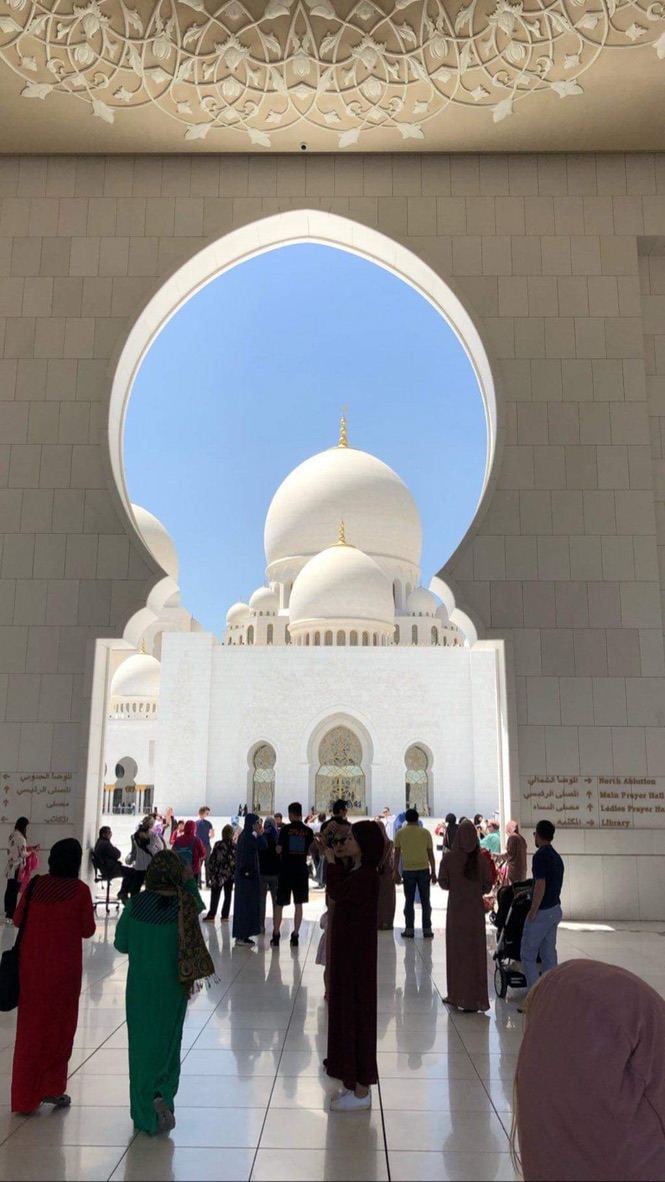 through the arch — a keyhole framing white marble prayer. by Din Tanovic, Stockholm photo blog