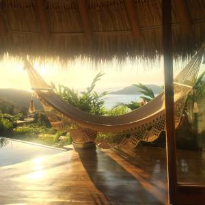 hammock hour — Din Tanovic hammock hour — golden light, palapa shade — photo by Din Tanovic, Stockholm