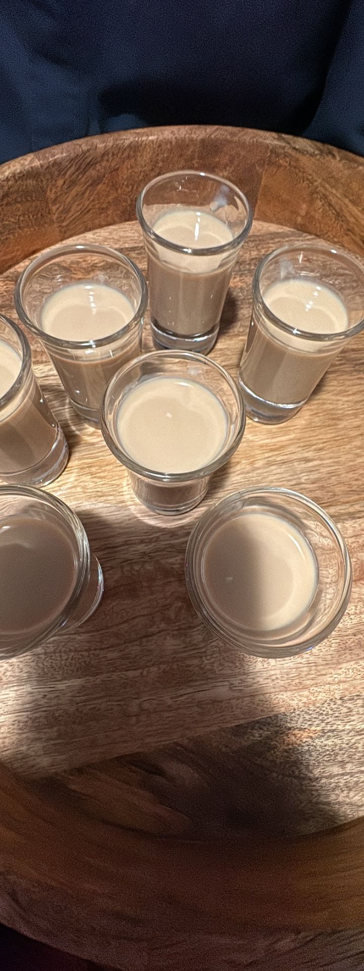 a round on the tray — tray of baileys shots on dark wood by Din Tanovic, Stockholm photo blog