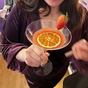 the signature pour — strawberry and orange cocktail — photo by Din Tanovic, Stockholm