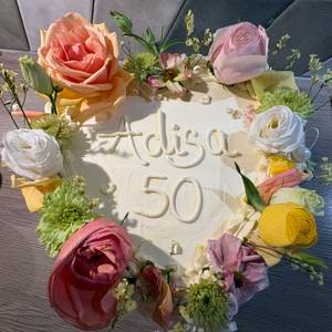 adisa 50 — buttercream, blooms, and half a century of her. — photo by Din Tanovic, Stockholm